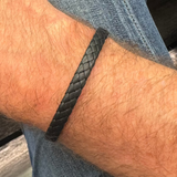 Wide woven cuff bracelet 6mm calf leather on mans wrist